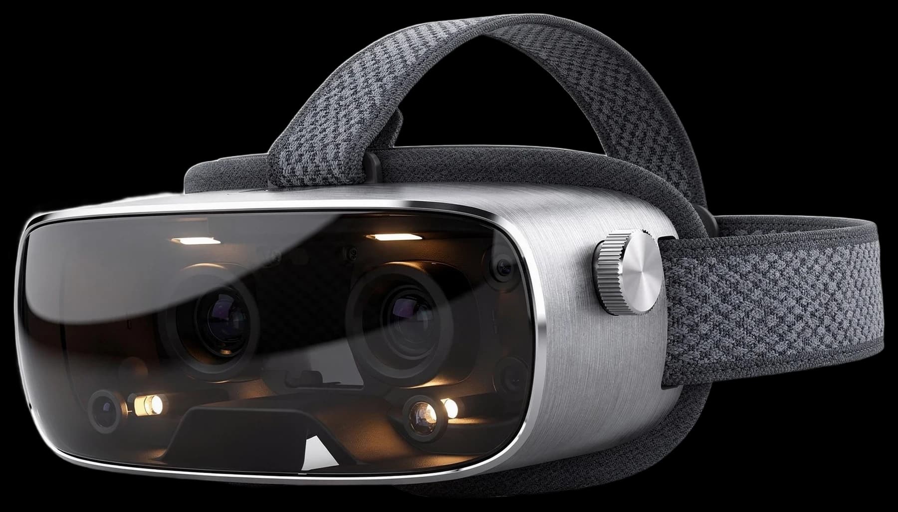 The Lucid One headset: a curved sheet of smoked glass wrapping a brushed aluminium frame, amber optics glowing through it, a knitted grey halo band behind